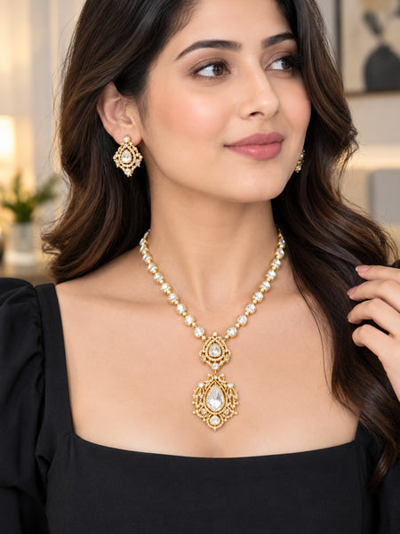 Elegant Golden Polki Necklace Set with Statement Pendant and Matching Earrings