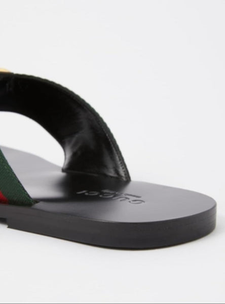 Stylish Black Flat Sandals with Signature Stripe Strap & Gold Logo Detail