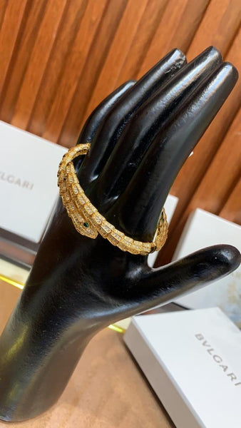 Premium Gold Bracelet  Diamonds and Two Emerald Eyes.
