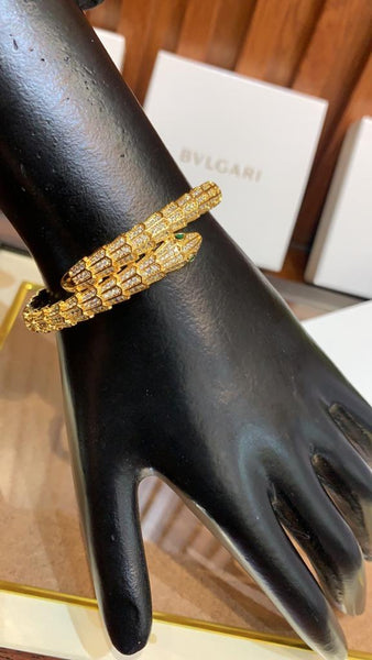Premium Gold Bracelet  Diamonds and Two Emerald Eyes.