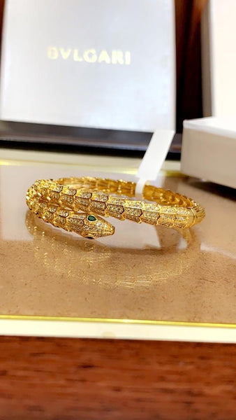 Premium Gold Bracelet  Diamonds and Two Emerald Eyes.