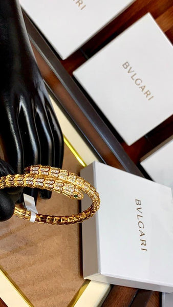 Premium Gold Bracelet  Diamonds and Two Emerald Eyes.