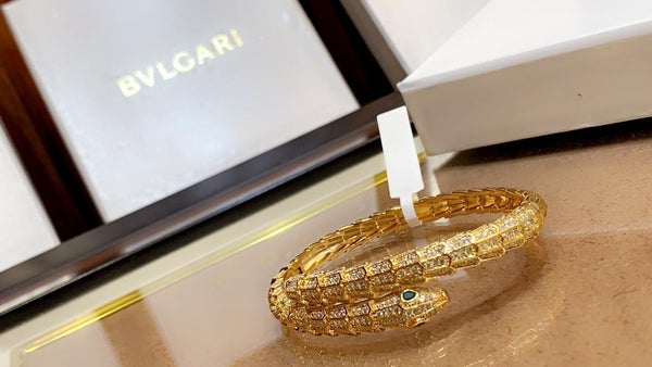 Premium Gold Bracelet  Diamonds and Two Emerald Eyes.