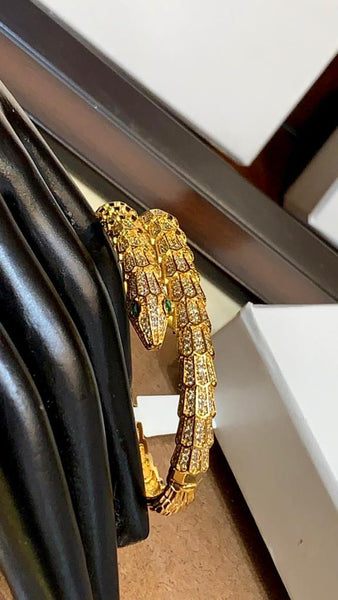 Premium Gold Bracelet  Diamonds and Two Emerald Eyes.