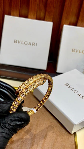 Premium Gold Bracelet  Diamonds and Two Emerald Eyes.