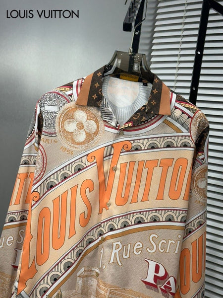 Premium brand men's long sleeve shirts in orange and blue colorways featuring 1 Rue Scribe Paris heritage graphic print with LV monogram pattern on display stands