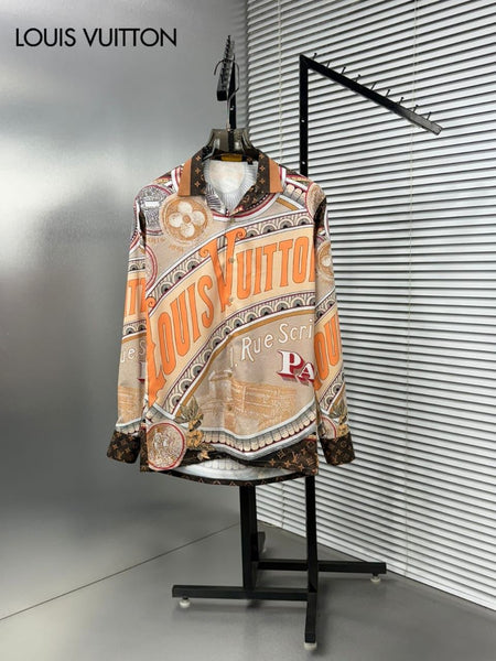 Premium brand men's long sleeve shirts in orange and blue colorways featuring 1 Rue Scribe Paris heritage graphic print with LV monogram pattern on display stands